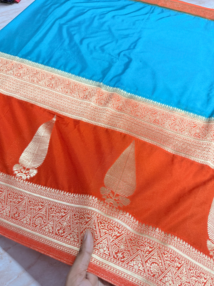 PEACOCK COLOUR KHADDI GEORGETTE WITH KAIRI BOOTA ON ORANGE BORDER