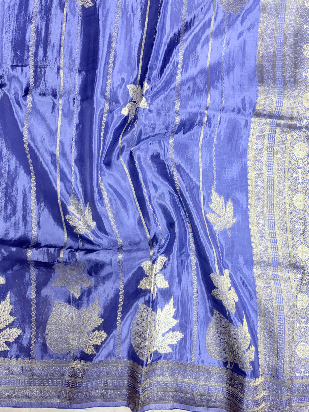 KOREAN SILK IN MATALLIC LIGHT LEVENDER WITH GOLD AND SILVER ZARI WORK