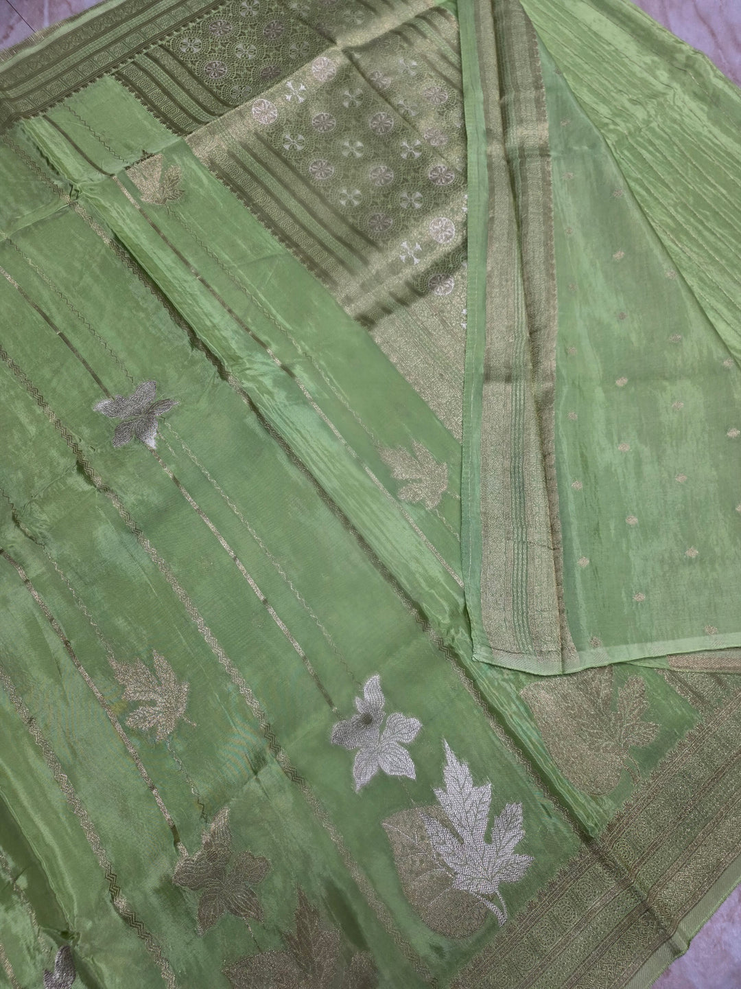 KOREAN SILK IN PISTA GREEN  WITH GOLD AND SILVER ZARI WORK