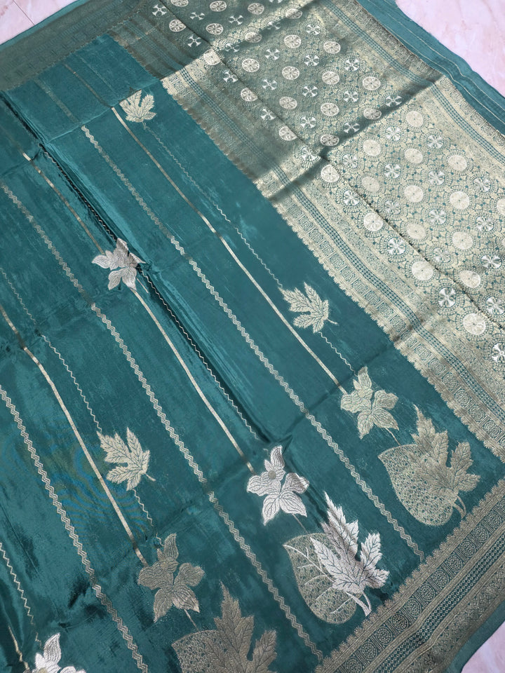KOREAN SILK IN MATALLIC BOTTLE GREEN WITH GOLD AND SILVER ZARI WORK
