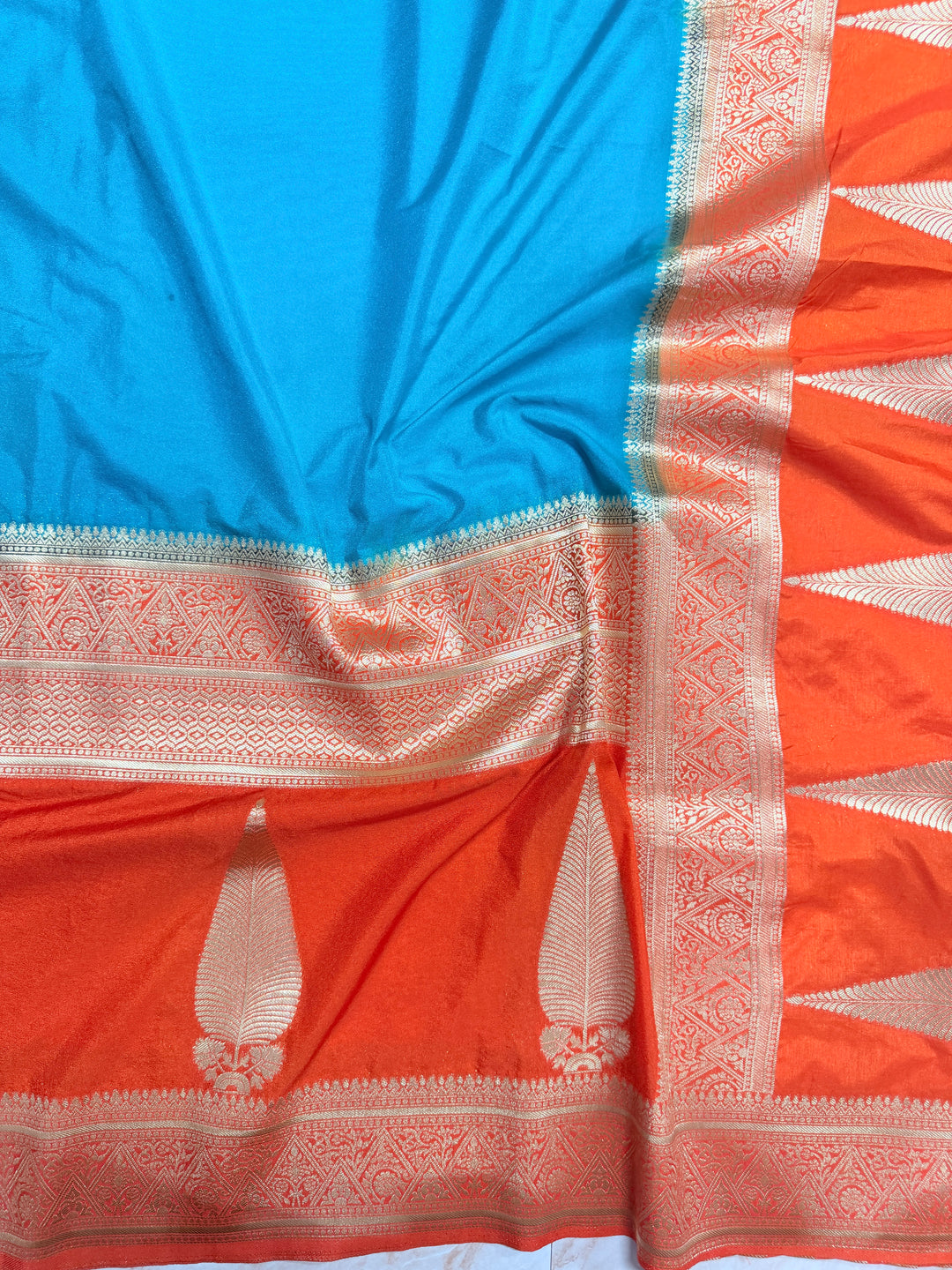 PEACOCK COLOUR KHADDI GEORGETTE WITH KAIRI BOOTA ON ORANGE BORDER