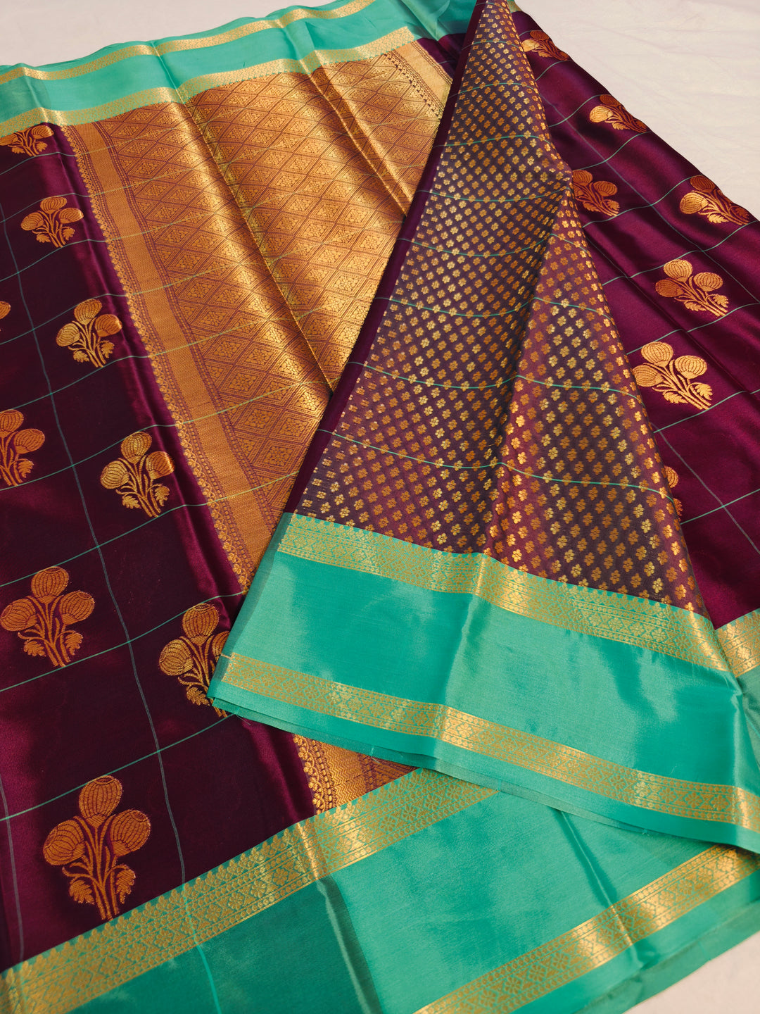 GARNET BANARASI SAREE WITH SEA GREEN BORDER INTRICATE CHECKS