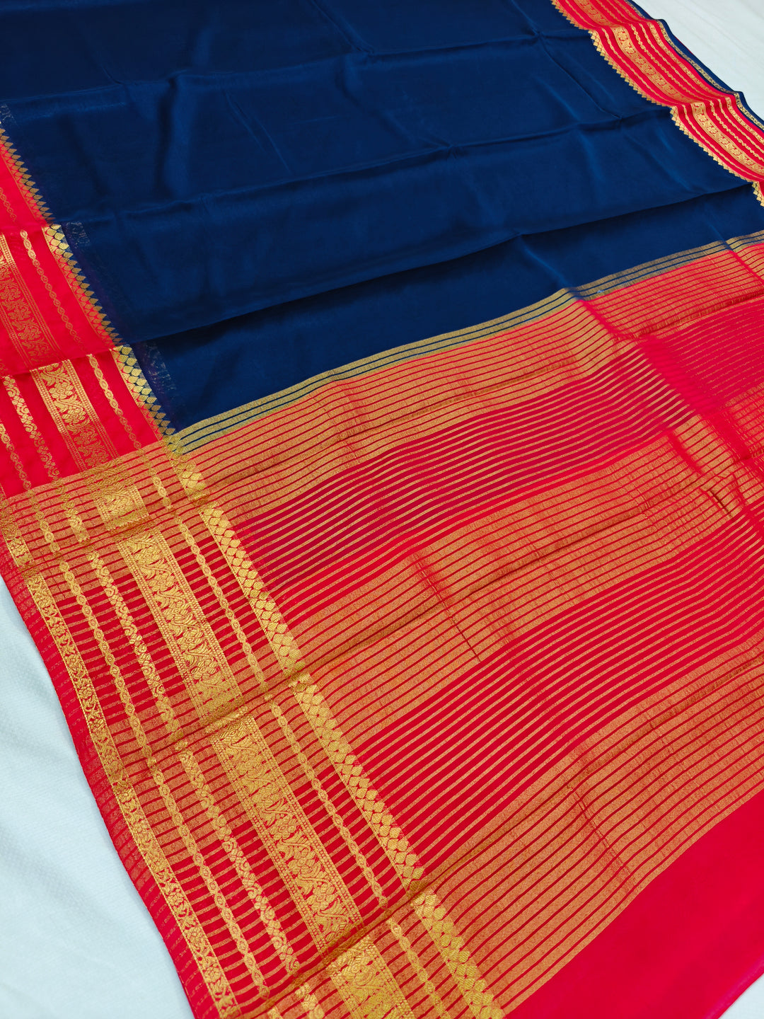NAVY BLUE CREPE WITH RED BORDER