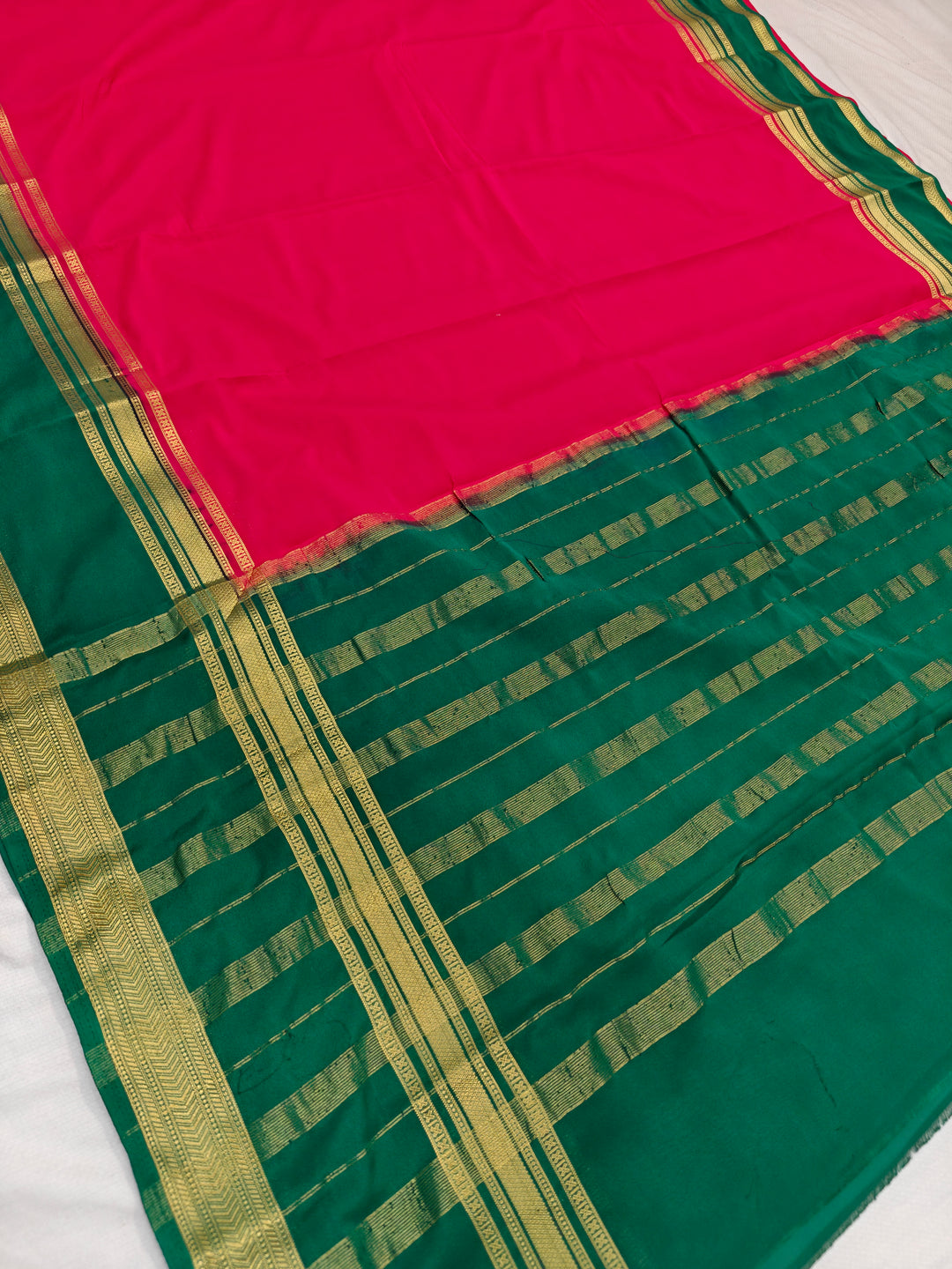RED CREPE WITH DARK GREEN BORDER