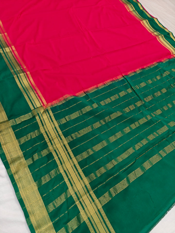 RED CREPE WITH DARK GREEN BORDER