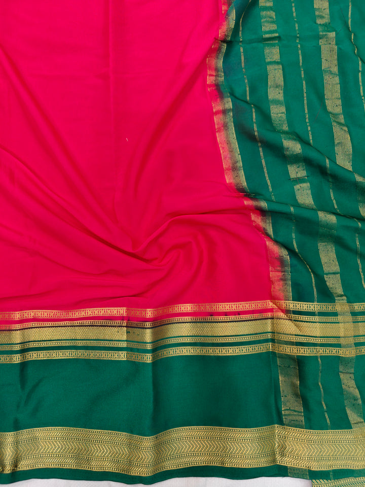 RED CREPE WITH DARK GREEN BORDER