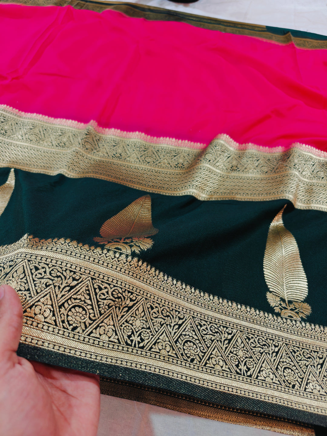 VIBRANT PINK KHADDI GEORGETTE WITH KAIRI BOOTA ON BLACK BORDER