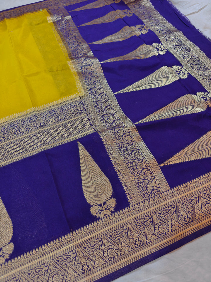 GOLD KHADDI GEORGETTE WITH KAIRI BOOTA ON MAGENTA BORDER