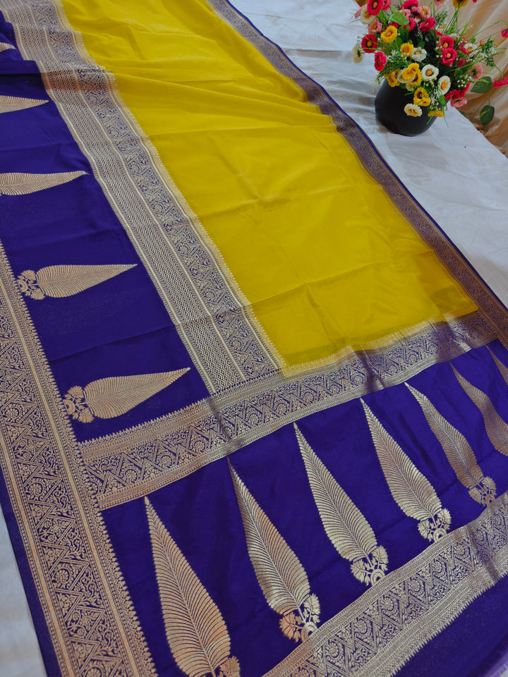 GOLD KHADDI GEORGETTE WITH KAIRI BOOTA ON MAGENTA BORDER