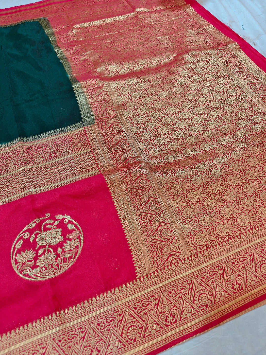 BOTTLE GREEN KHADDI GEORGETTE WITH RED BORDER