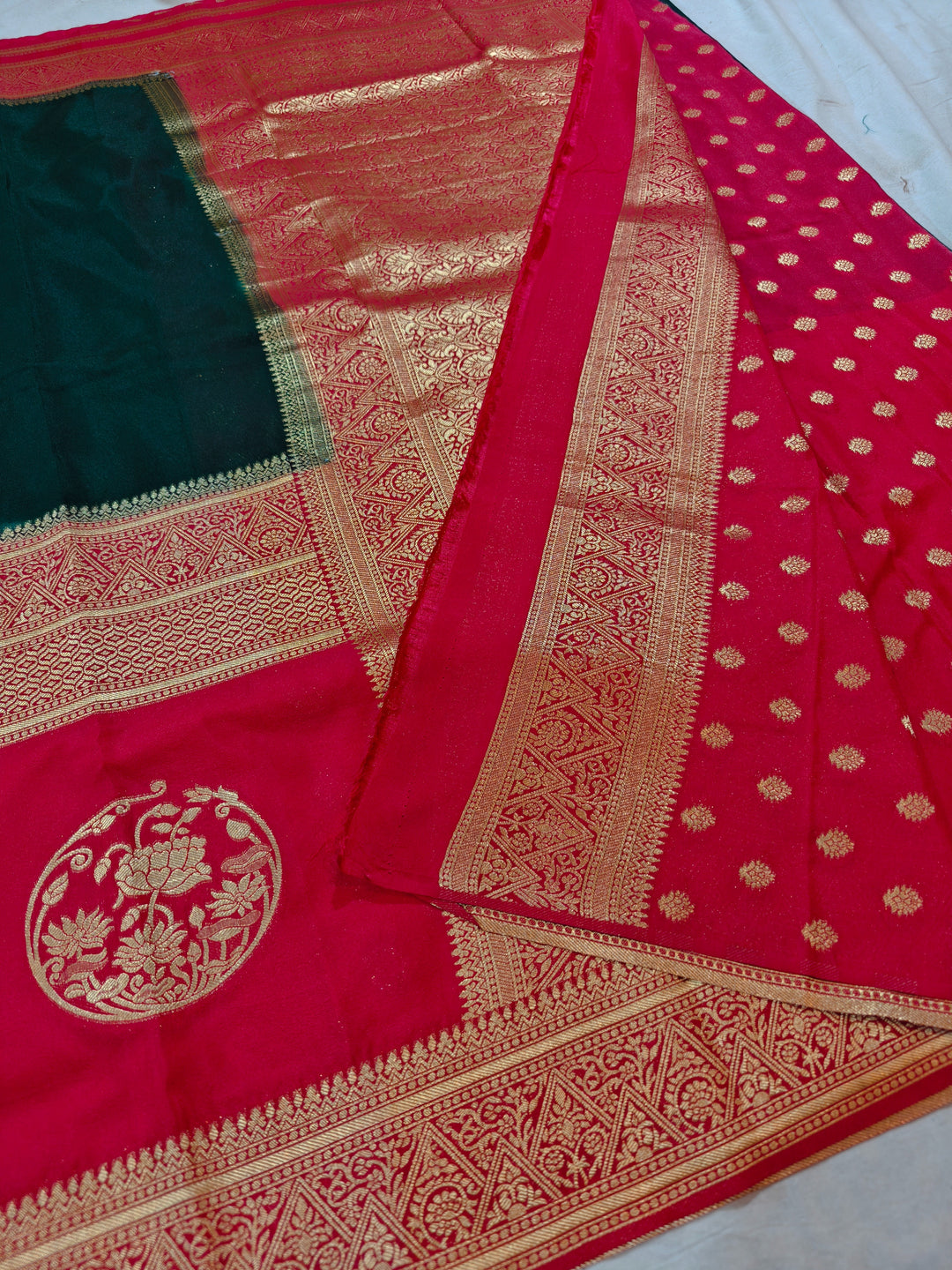 BOTTLE GREEN KHADDI GEORGETTE WITH RED BORDER