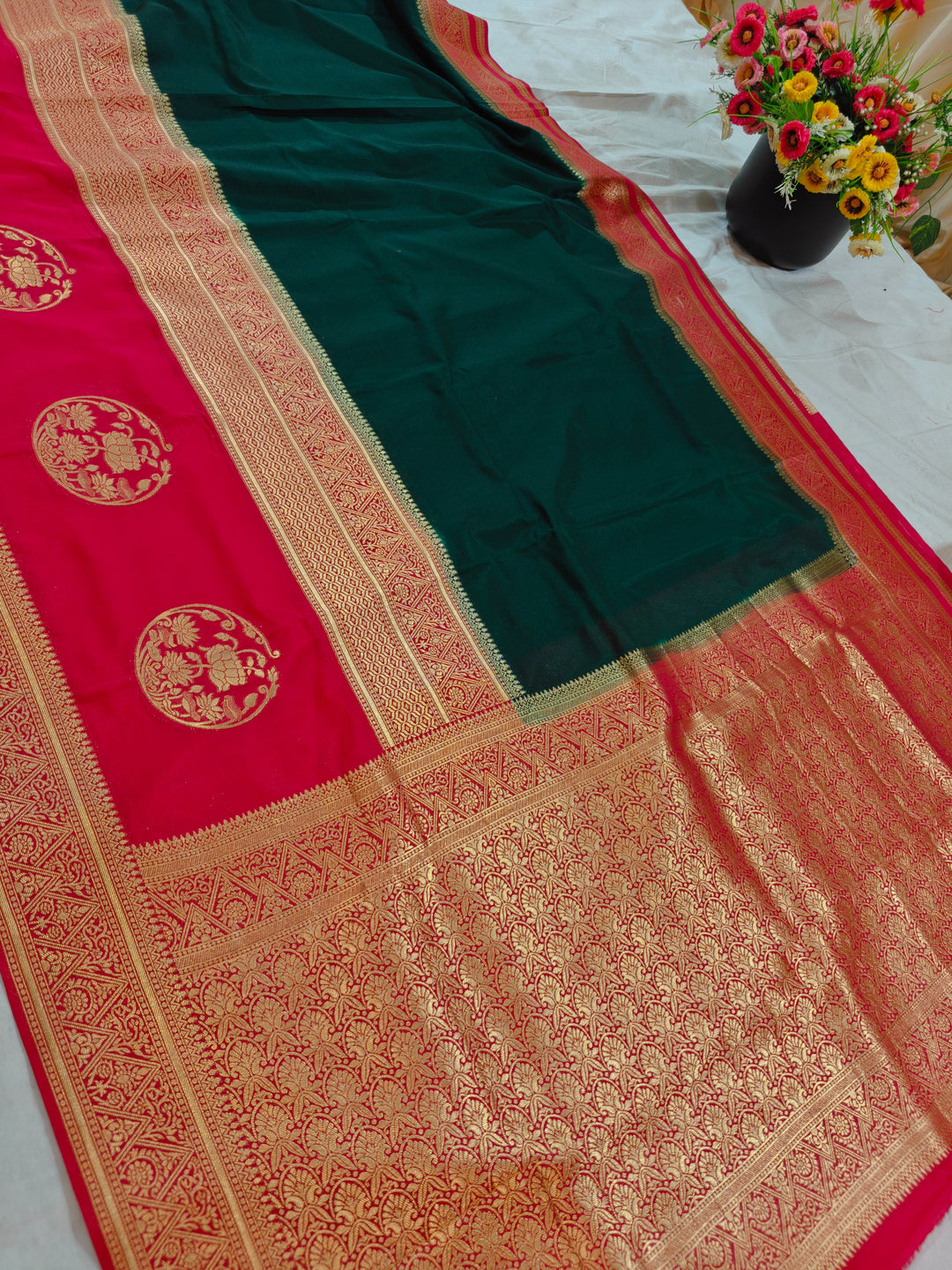 BOTTLE GREEN KHADDI GEORGETTE WITH RED BORDER