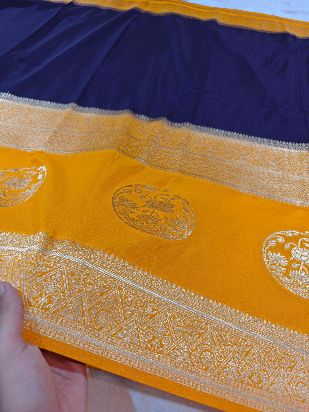 NAVY BLUE KHADDI GEORGETTE WITH GOLD BORDER