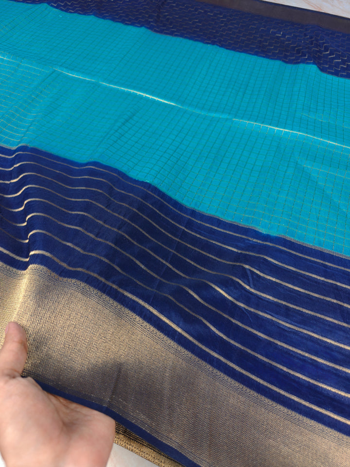 KHADDI GEORGETTE IN BLUE WITH NAVY BLUE BORDER
