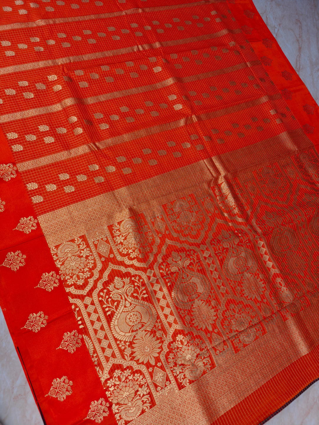 CREPE GEORGETTE IN TANGY ORANGE WITH CHECKS WORK