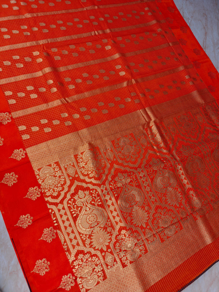 CREPE GEORGETTE IN TANGY ORANGE WITH CHECKS WORK