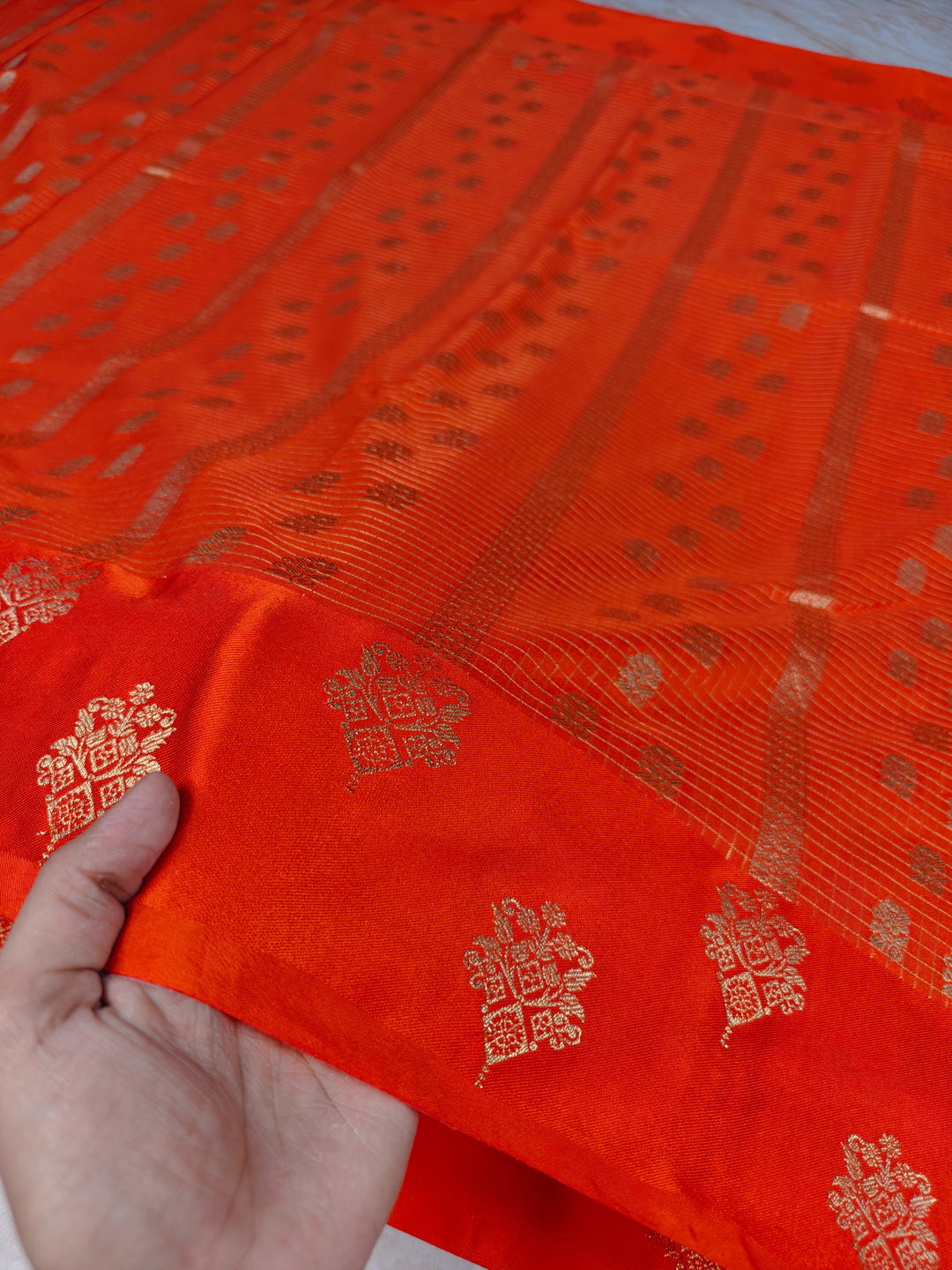 CREPE GEORGETTE IN TANGY ORANGE WITH CHECKS WORK