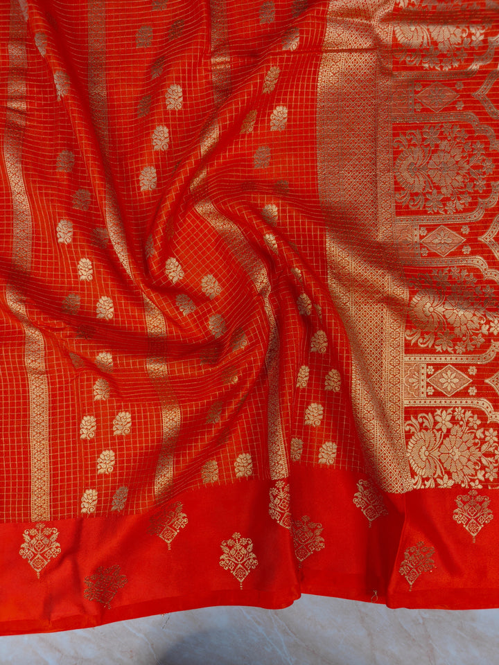 CREPE GEORGETTE IN TANGY ORANGE WITH CHECKS WORK