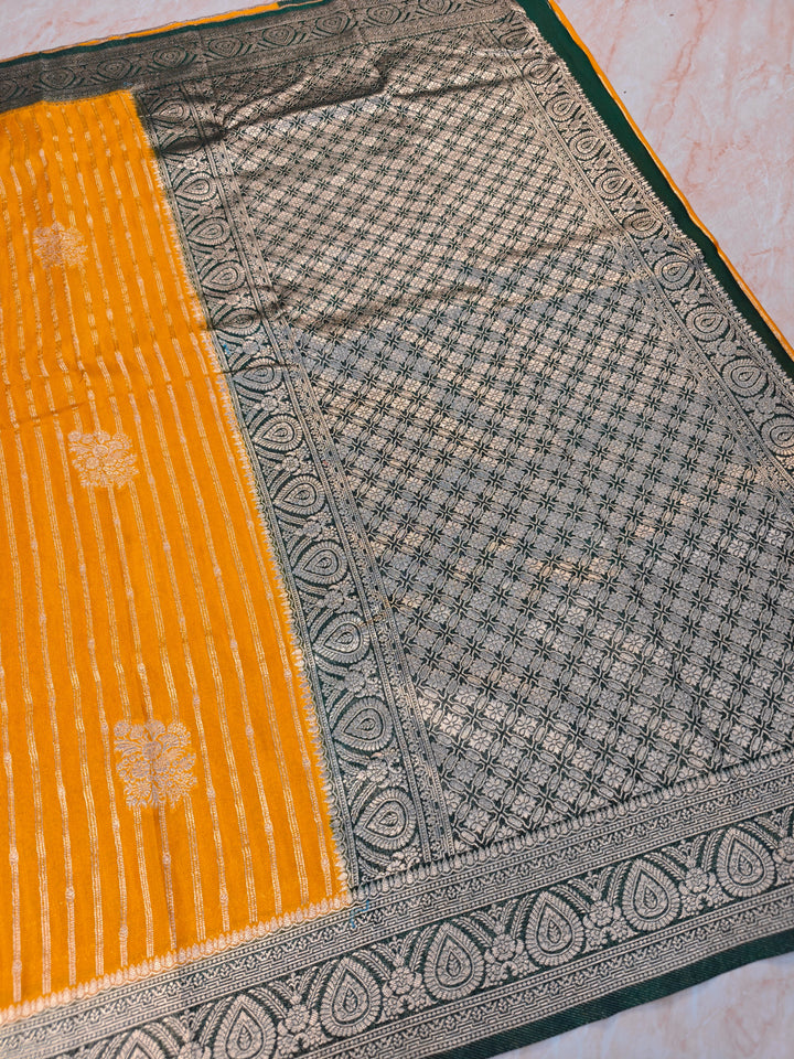 KHADDI GEORGETTE IN MUSTARD GOLD WITH BOTTLE GREEN BORDER