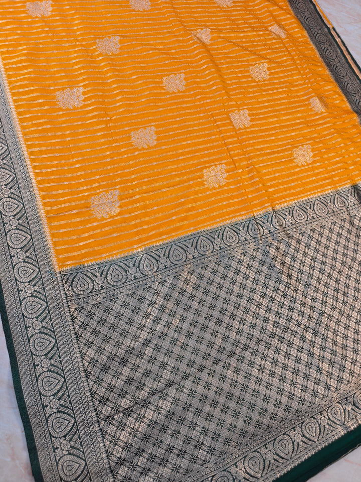KHADDI GEORGETTE IN MUSTARD GOLD WITH BOTTLE GREEN BORDER