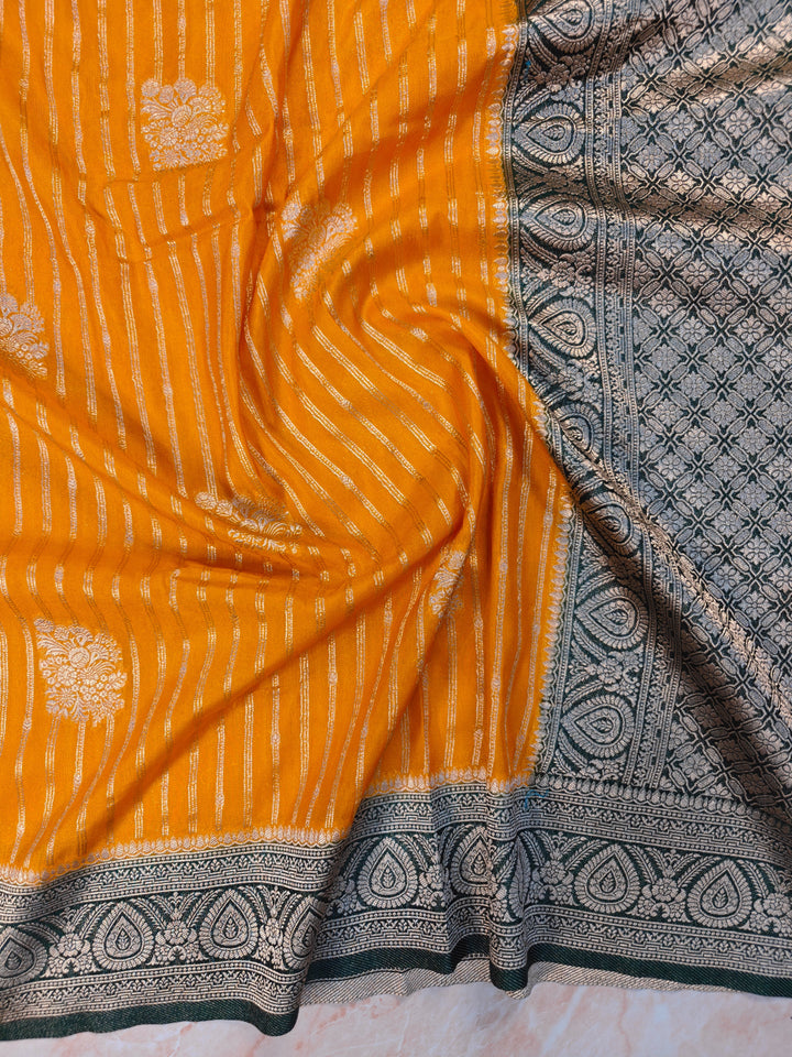 KHADDI GEORGETTE IN MUSTARD GOLD WITH BOTTLE GREEN BORDER