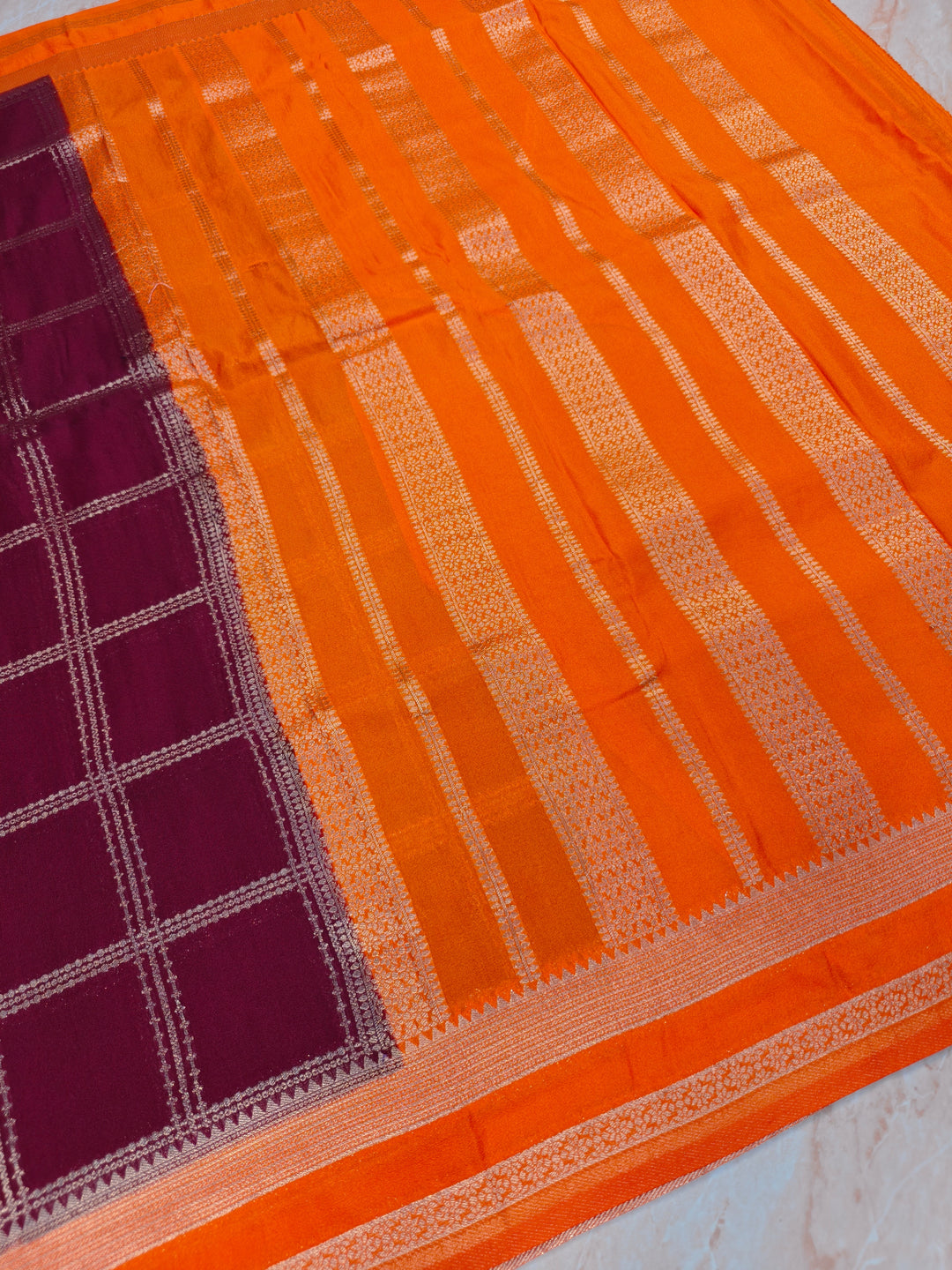 KHADDI GEORGETTE IN GARNET WITH TANGY ORANGE BORDER