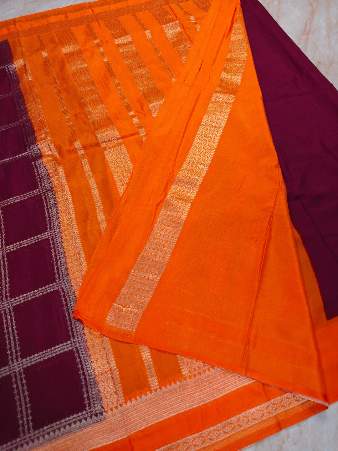 KHADDI GEORGETTE IN GARNET WITH TANGY ORANGE BORDER