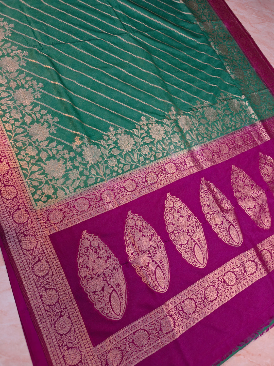 KHADDI GEORGETTE IN BOTTLE GREEN WITH MAGENTA BORDER