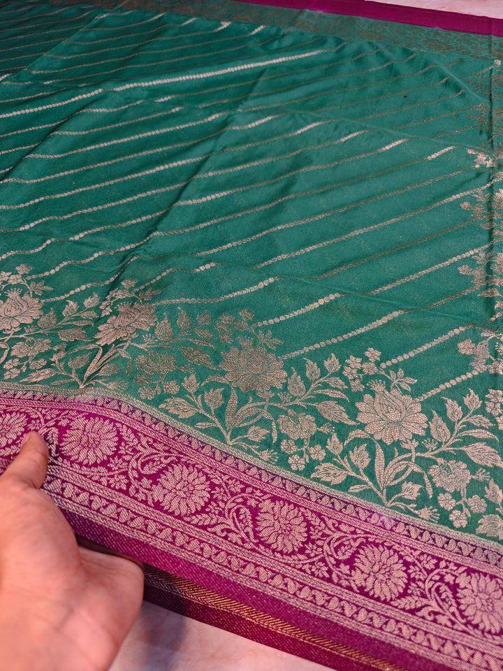 KHADDI GEORGETTE IN BOTTLE GREEN WITH MAGENTA BORDER