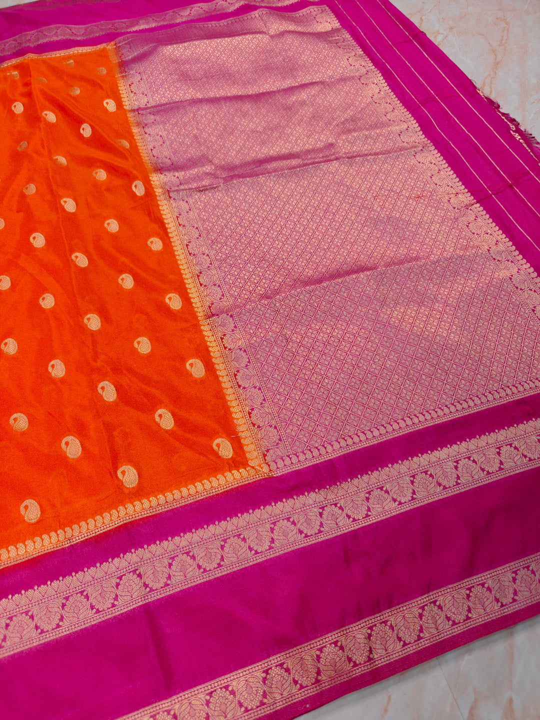 KHADDI GEORGETTE IN ORANGE WITH RANI BORDER