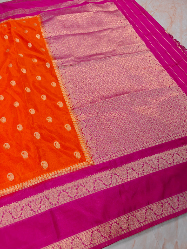 KHADDI GEORGETTE IN ORANGE WITH RANI BORDER