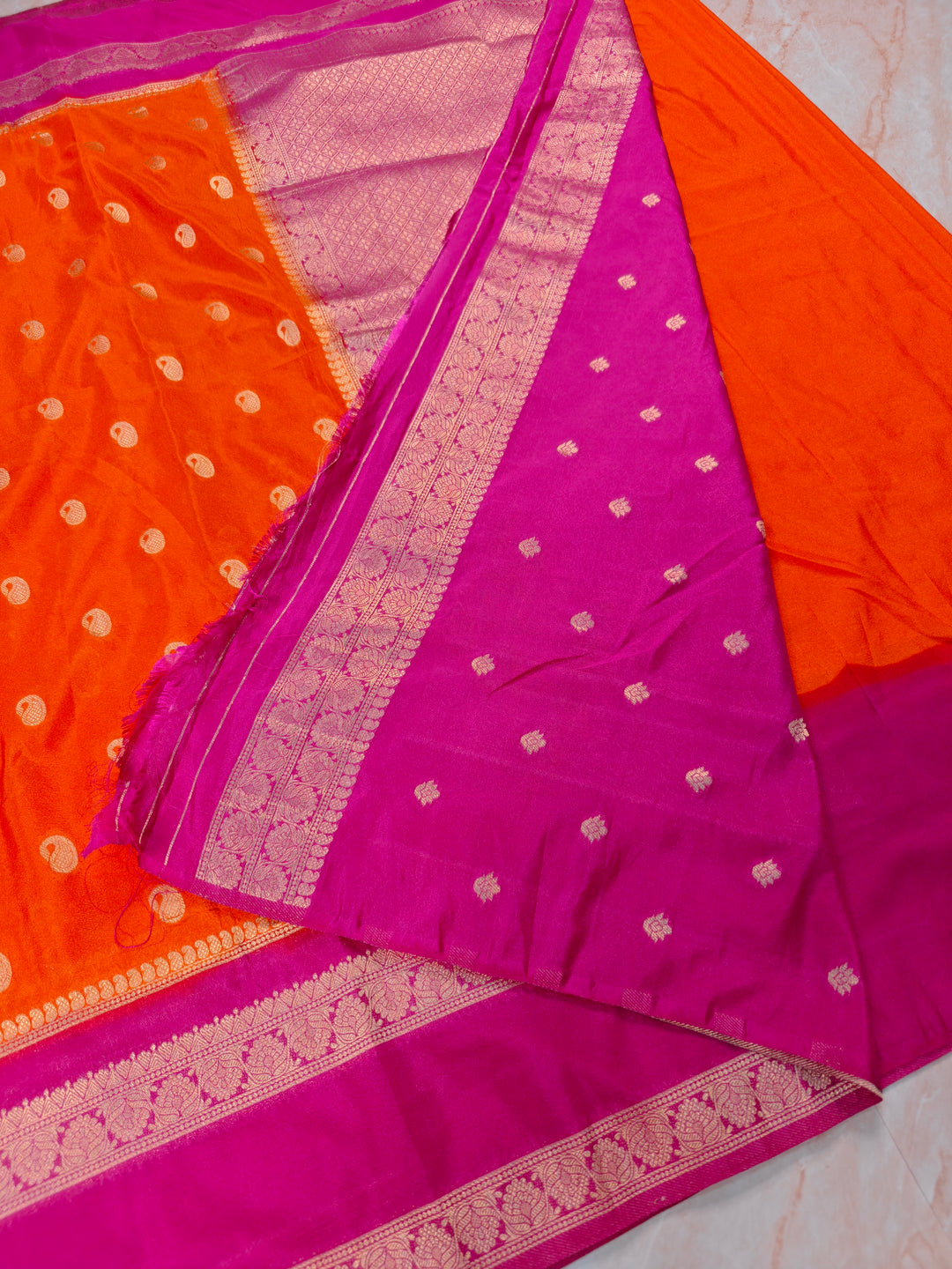 KHADDI GEORGETTE IN ORANGE WITH RANI BORDER