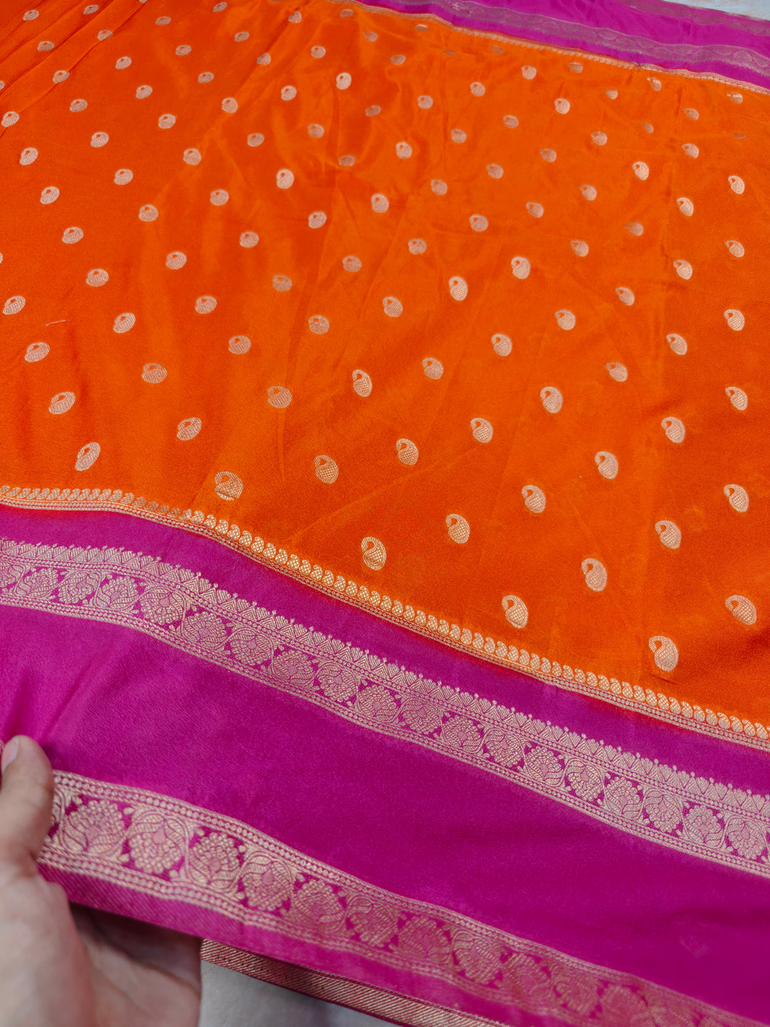 KHADDI GEORGETTE IN ORANGE WITH RANI BORDER