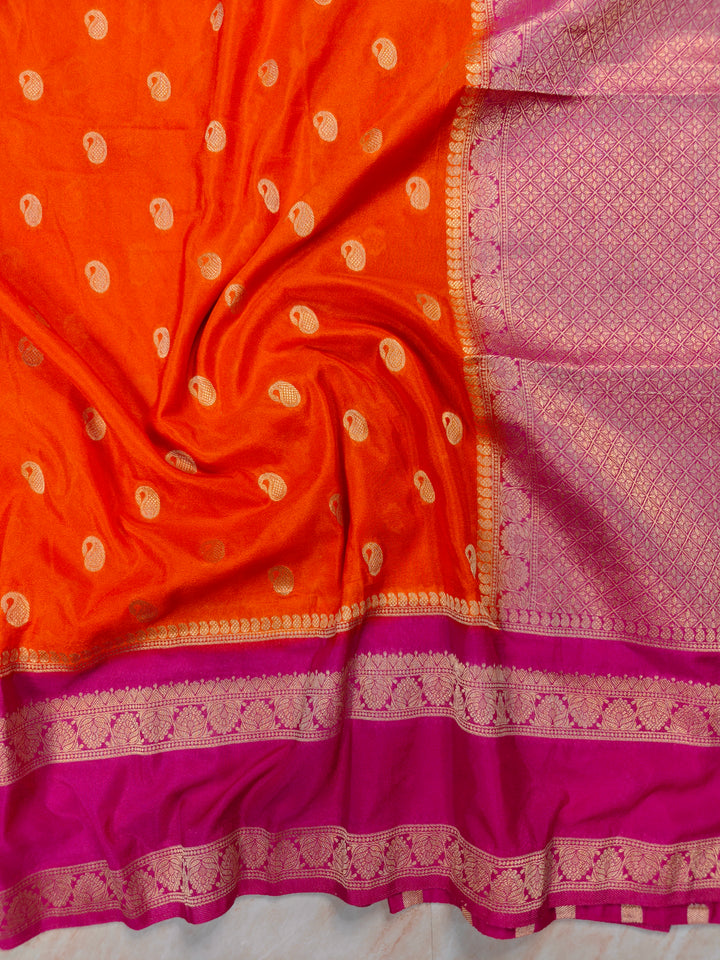 KHADDI GEORGETTE IN ORANGE WITH RANI BORDER