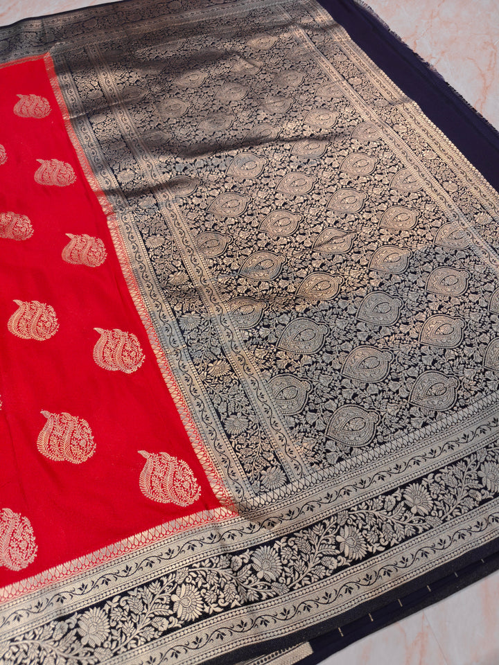KHADDI GEORGETTE IN RED WITH CHARCOAL BLACK BORDER