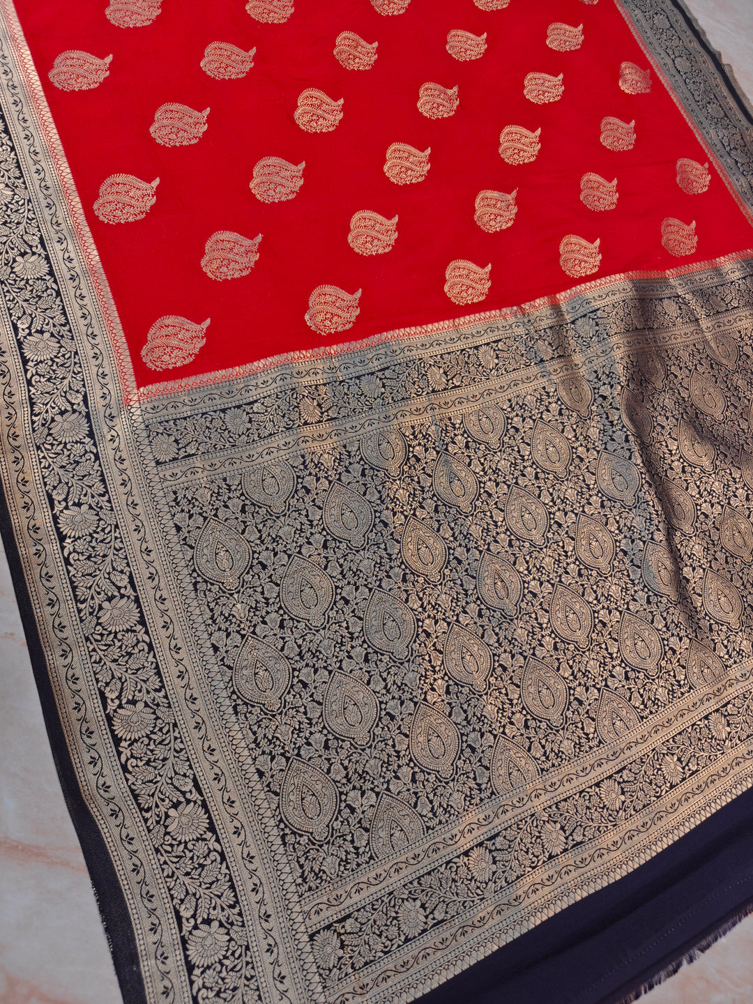 KHADDI GEORGETTE IN RED WITH CHARCOAL BLACK BORDER