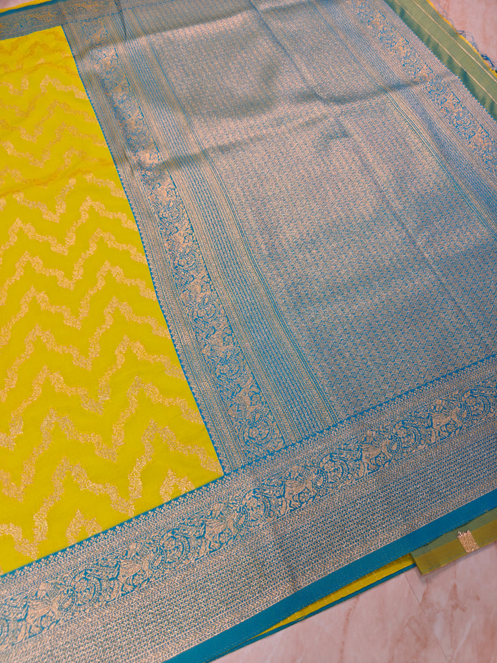 BANARASI KATAN SILK IN GOLD WITH SKY BLUE BORDER