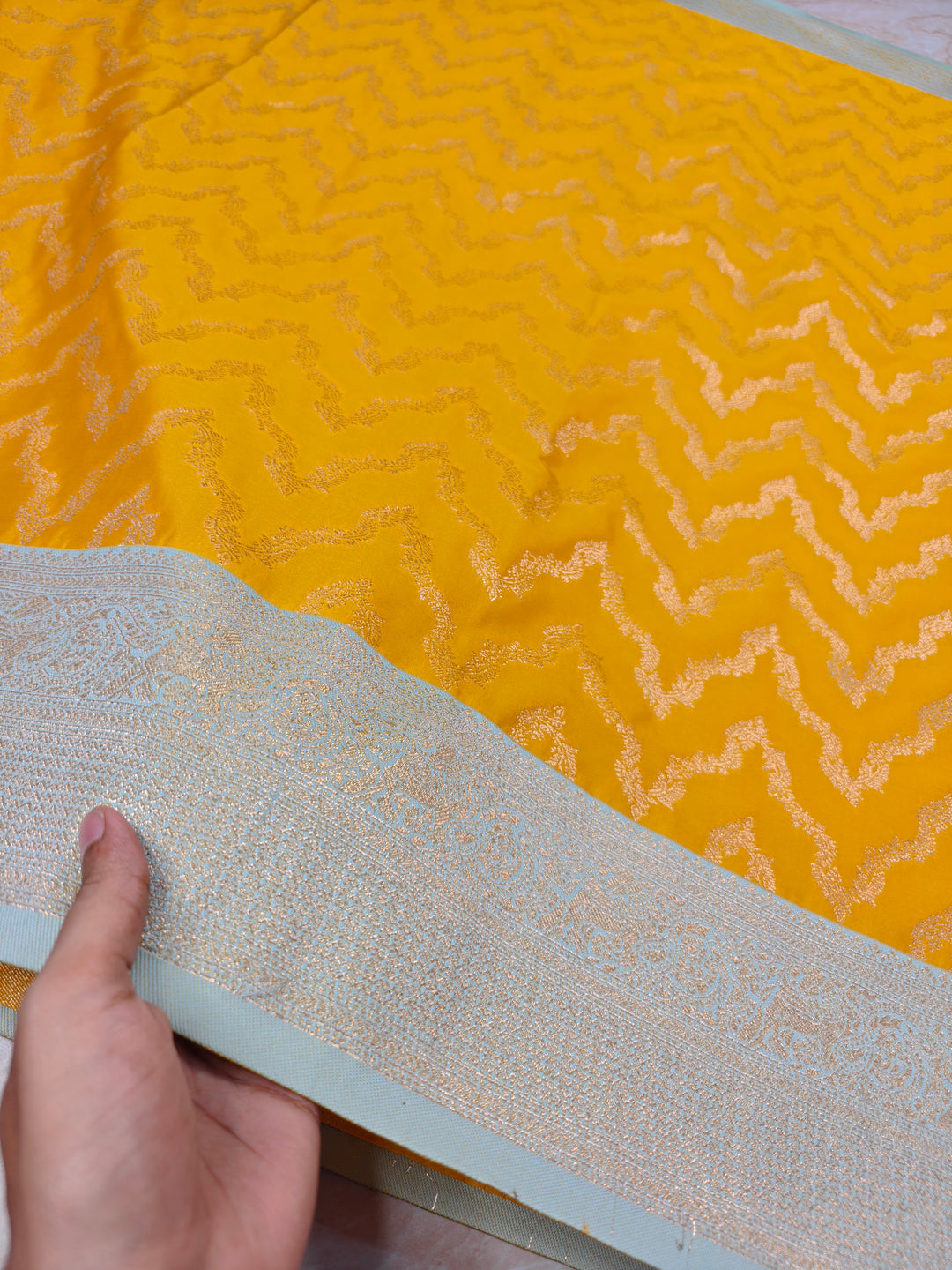 BANARASI KATAN SILK IN AIRY GOLD WITH LIGHT BLUE BORDER