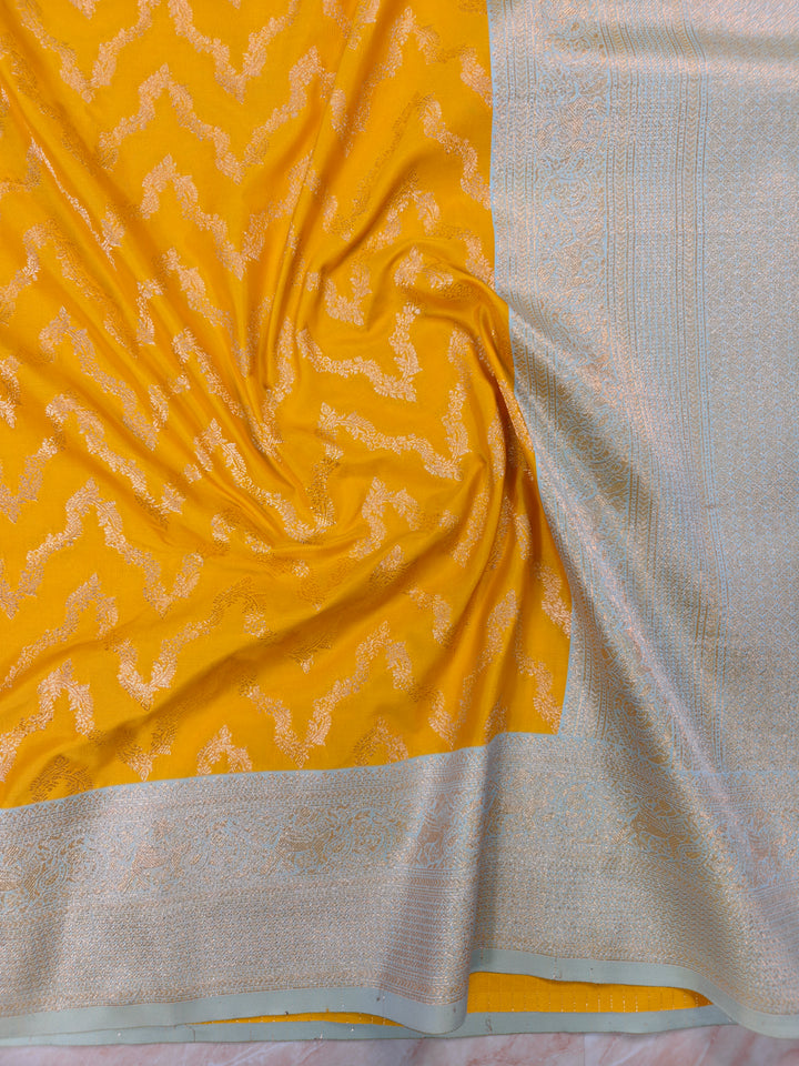 BANARASI KATAN SILK IN AIRY GOLD WITH LIGHT BLUE BORDER
