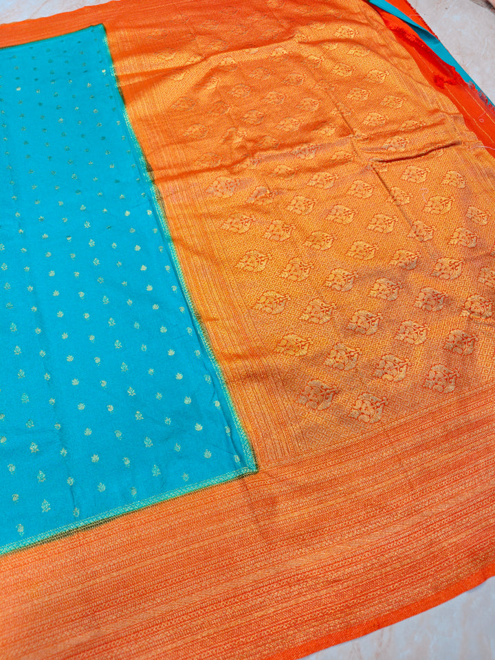 SEA GREEN KHADDI GEORGETTE WITH ORANGE BORDER