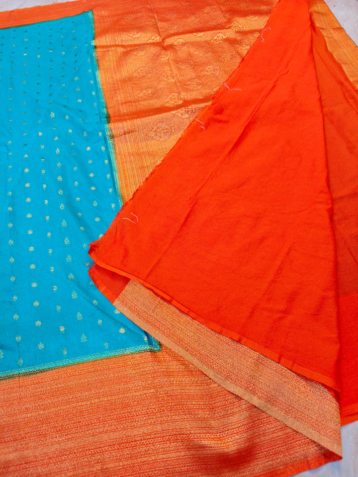 SEA GREEN KHADDI GEORGETTE WITH ORANGE BORDER