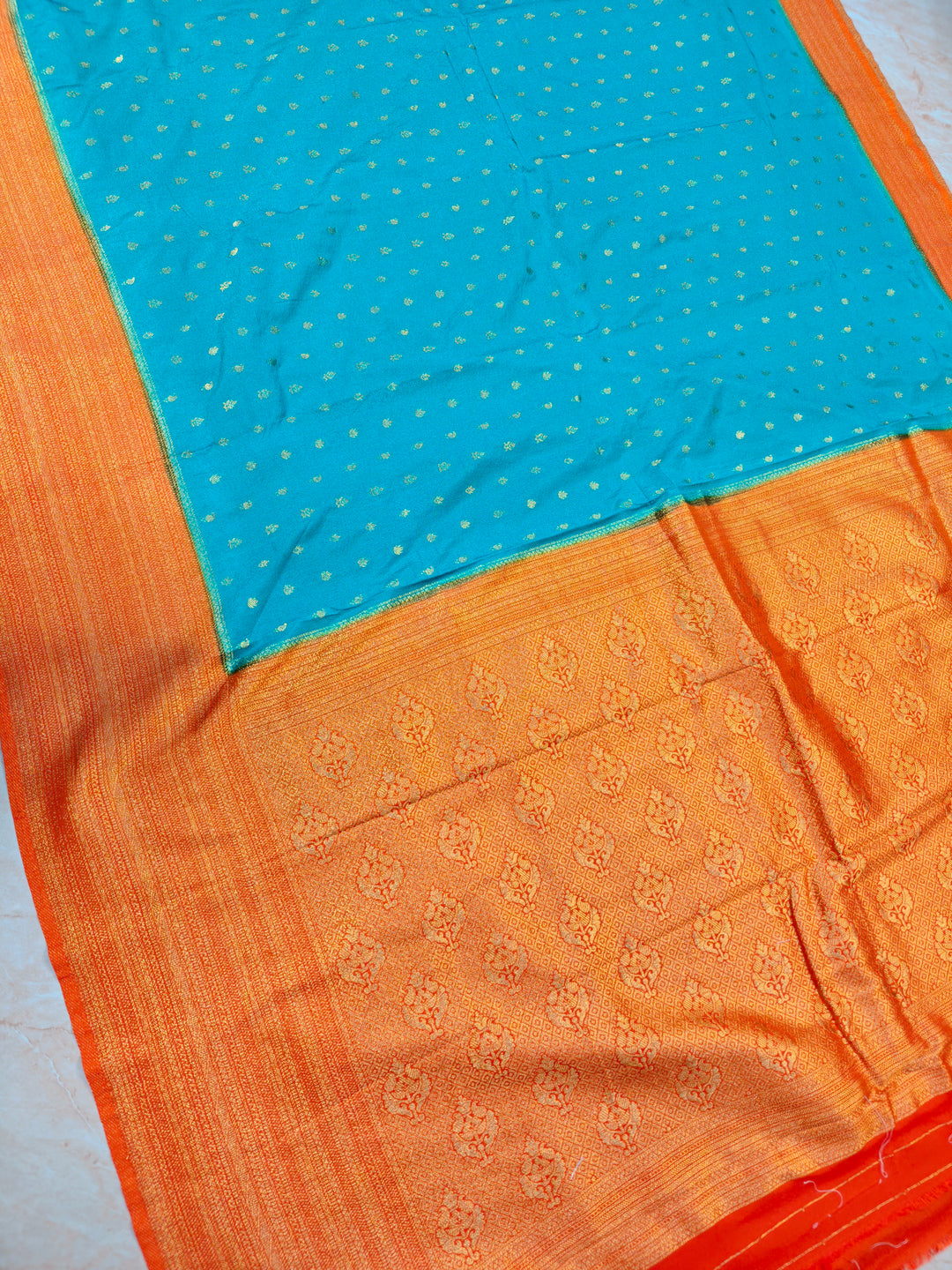 SEA GREEN KHADDI GEORGETTE WITH ORANGE BORDER