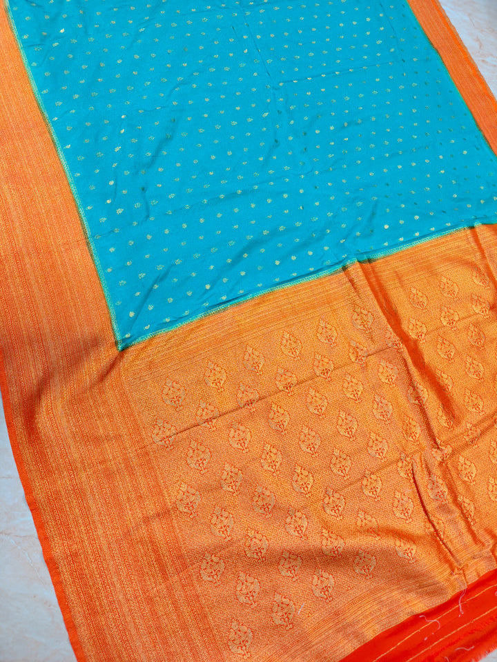 SEA GREEN KHADDI GEORGETTE WITH ORANGE BORDER