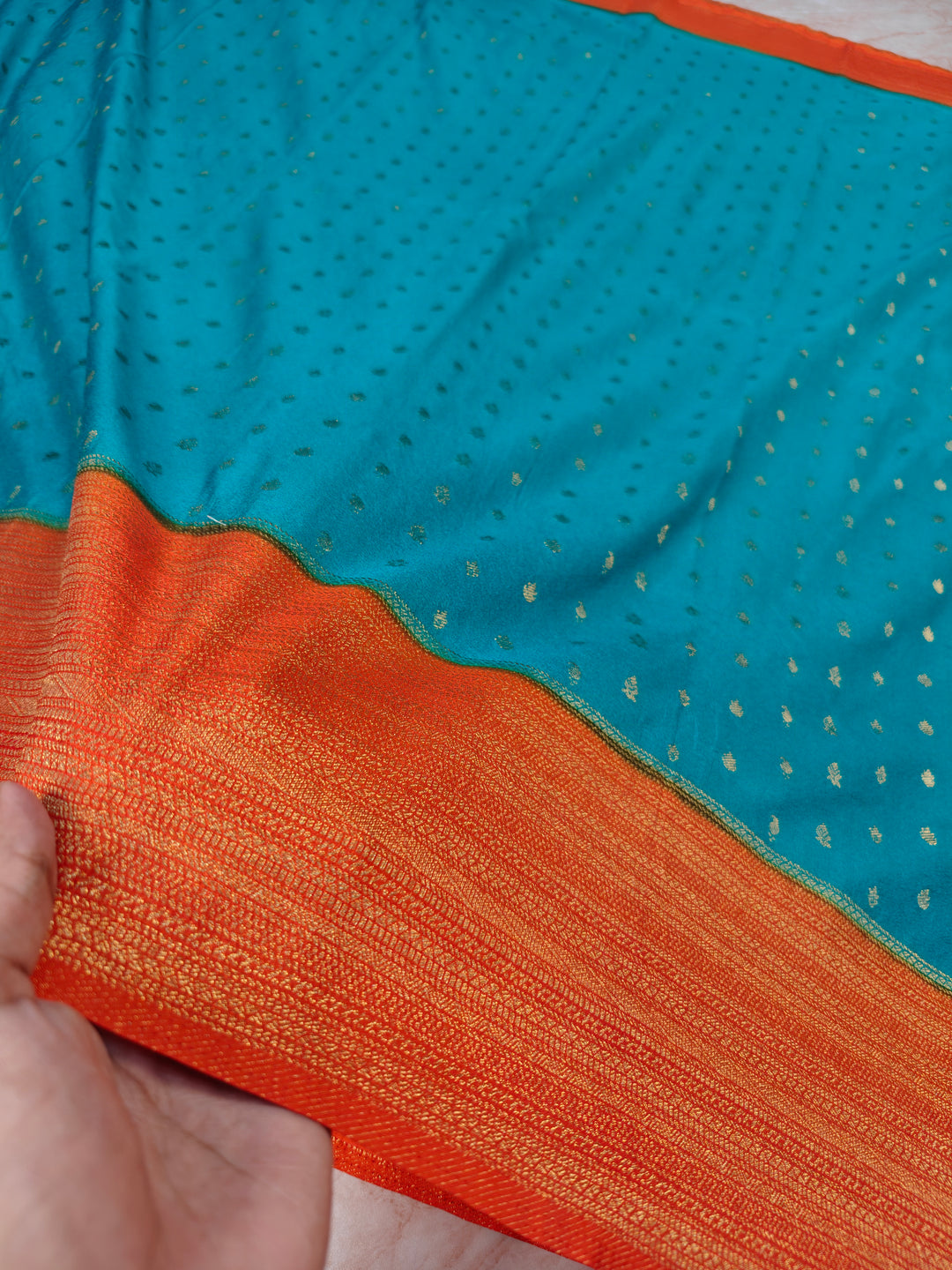 SEA GREEN KHADDI GEORGETTE WITH ORANGE BORDER