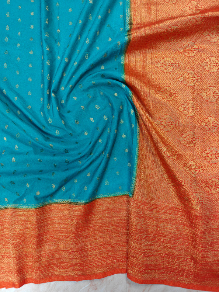 SEA GREEN KHADDI GEORGETTE WITH ORANGE BORDER
