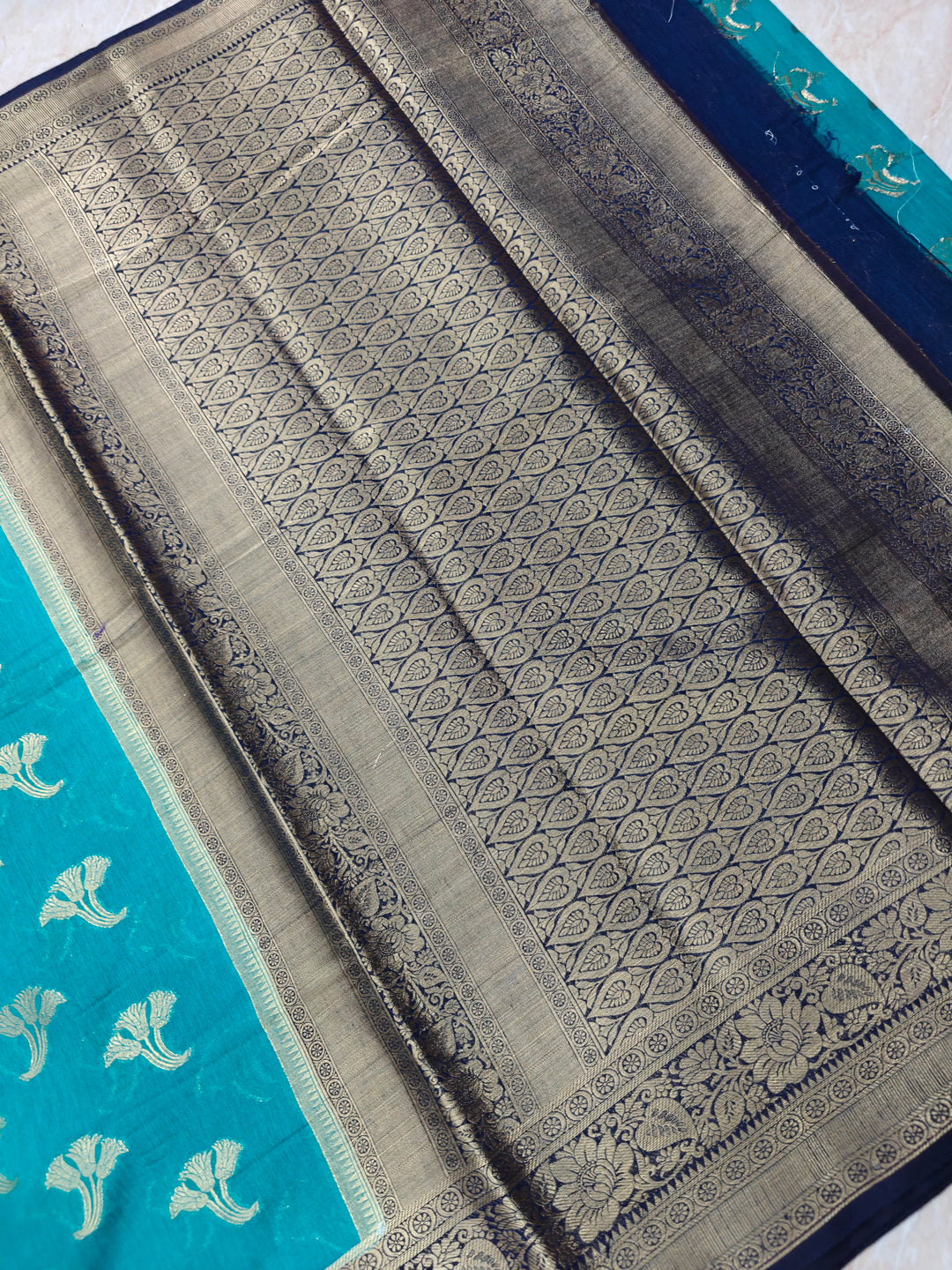 BANARASI SILK IN TEAL BLUE WITH NAVY BLUE BOREDR