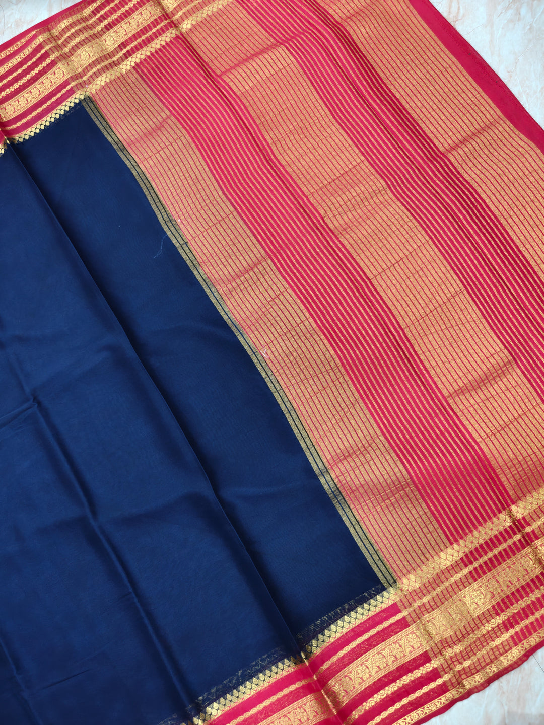 CREPE GEORGETTE IN NAVY BLUE WITH RED BORDER