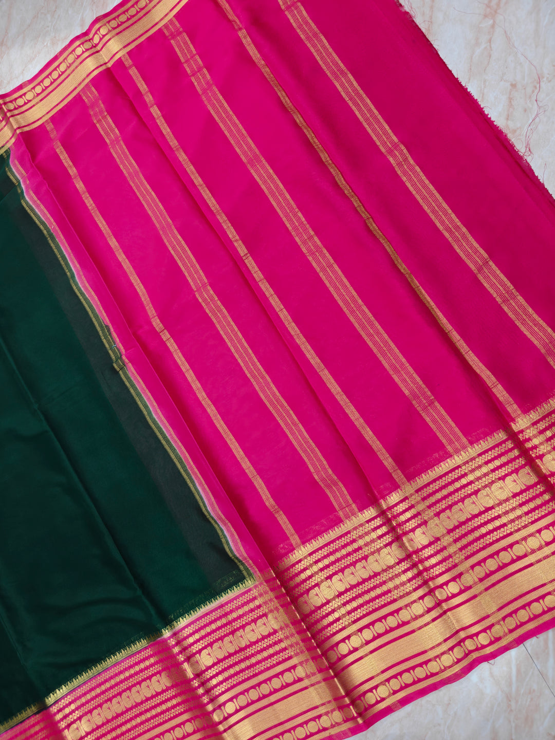 CREPE GEORGETTE IN BOTTLE GREEN WITH RANI BORDER