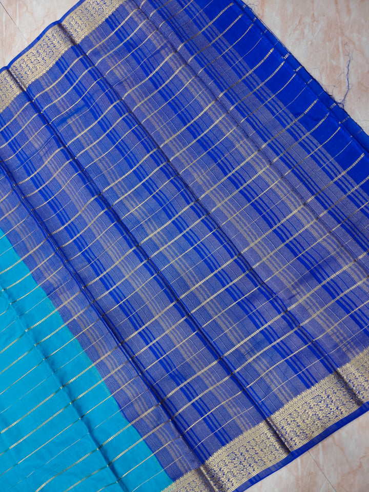 CREPE  GEORGETTE IN OCEAN BLUE WITH ROYAL BLUE  BORDER