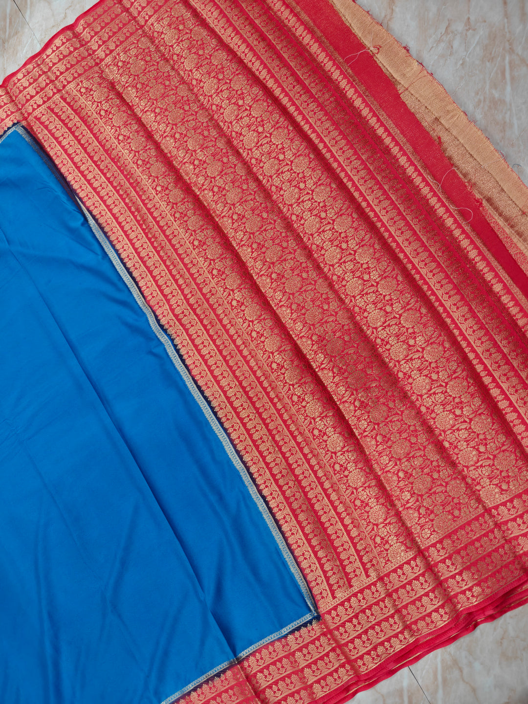 CREPE GEORGETTE IN ROYAL BLUE WITH PEACH  BORDER
